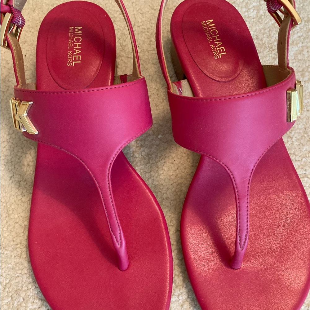 Michael Kors Pink Sandals size 7 detailed on the some of the shoe
